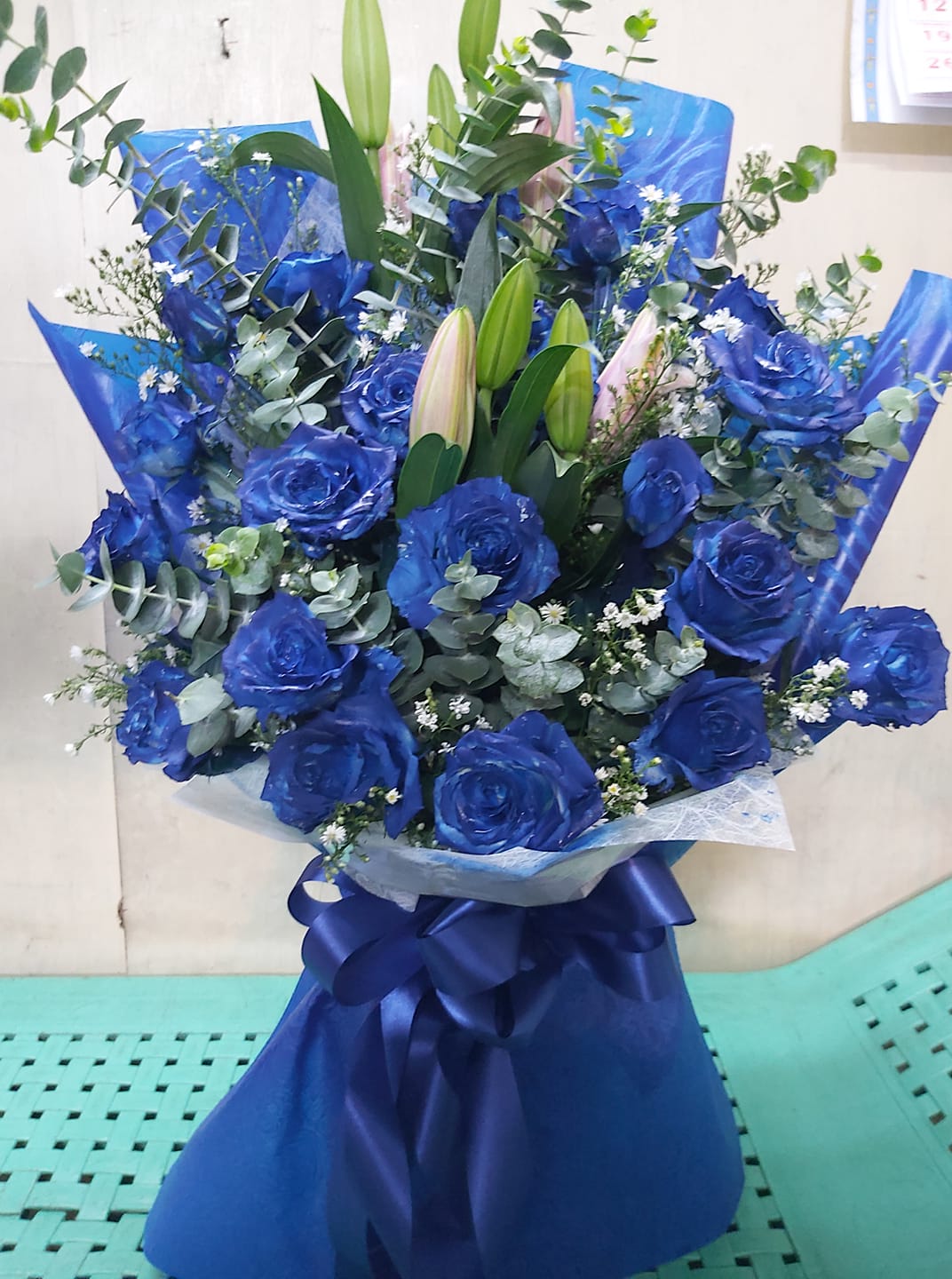 Blue roses bouquet with stargazer