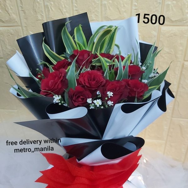 one dozen red roses with tropical fillers